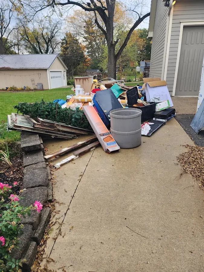 Dumpster being loaded with debris for 12 Yard Dumpster Rental in North Strabane